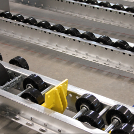 Pallet Retention Device For Pallet Flow