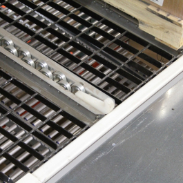 Staggered Skate Wheel On Bar Grating