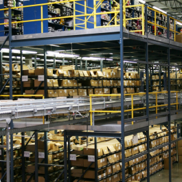 Conveyor Into Pick Module Supported by UNARCO Pallet Rack